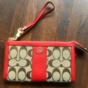 Red and tan Coach wallet / wristlet
